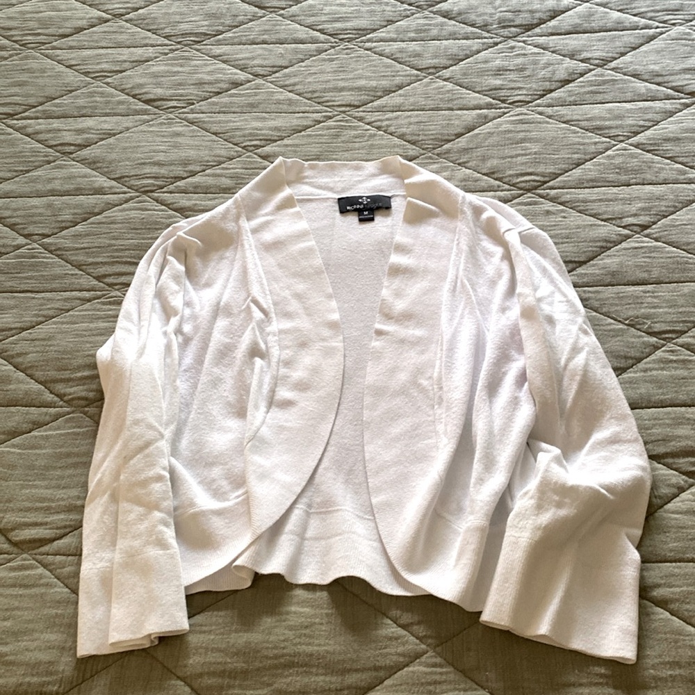Beautiful white cardigan . Wear it on top of a spaghetti strap top with jeans .